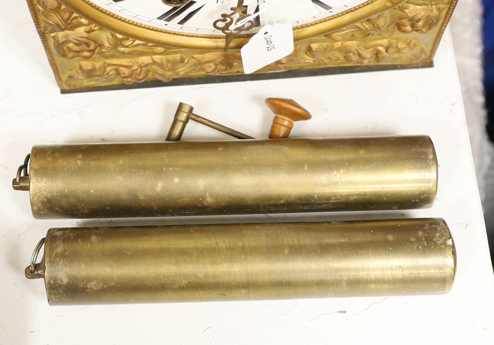 A 19th century French eight day longcase clock movement, with circular enamelled dial with weights, clock front 45cm high
